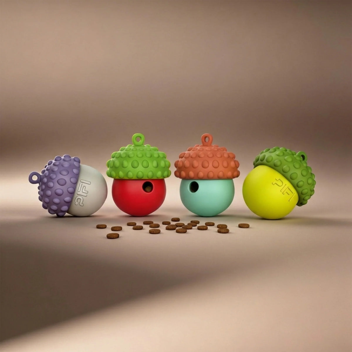 Four MyPiFi DentalFlex dog enrichment treat-dispensing toys in assorted colours with kibble, designed for interactive feeding, chewing, and mental stimulation.